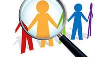 A magnifying glass focusing on colorful human figures, representing the concept of searching for or analyzing people.