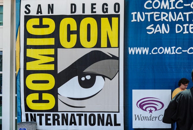 Signage for San Diego Comic-Con International, featuring the iconic eye logo, with information about Comic-Con and WonderCon.