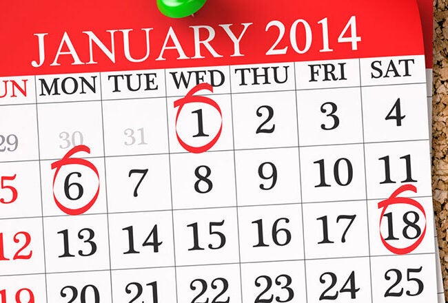 A January 2014 calendar page pinned to a corkboard. The dates 1, 6, and 18 are circled in red.