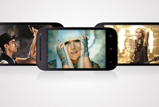 Three smartphones displaying music videos. The first shows a person in a hat, the second features a person with white hair, and the third has a guitarist performing.