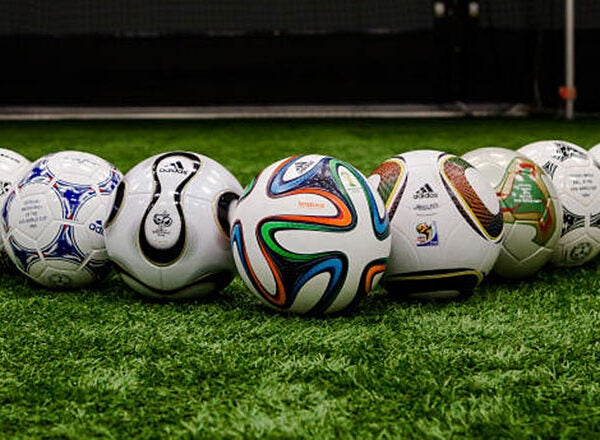 a) The seven FIFA official match balls and two generic balls used