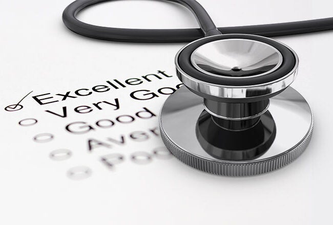 A stethoscope resting on a checklist form with options ranging from "Poor" to "Excellent." The "Excellent" option is checked, suggesting a positive assessment or review.