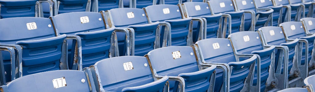 Blue stadium seats arranged in rows, each labeled with numbers.