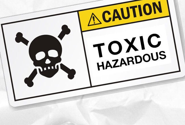 A caution sign with a skull and crossbones symbol, reading "Toxic Hazardous" indicates danger or poisonous material.