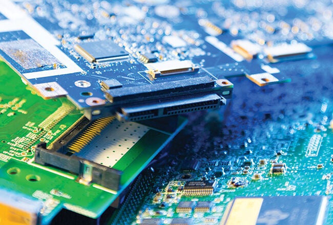 Close-up of stacked electronic circuit boards with various components, representing technology and electronics.