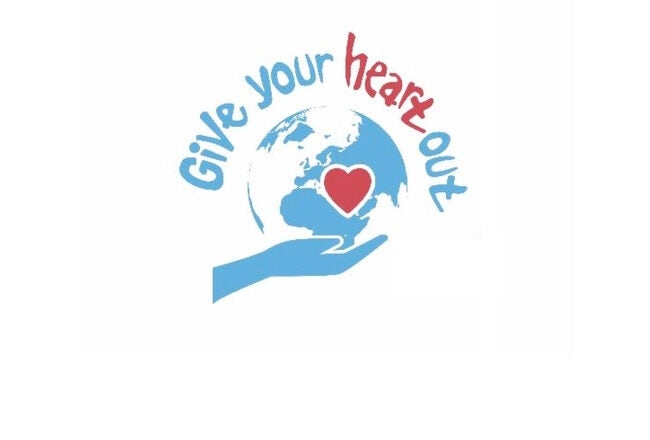Logo with a blue globe held by a hand, featuring a red heart in the center. Text above reads "Give your heart out".
