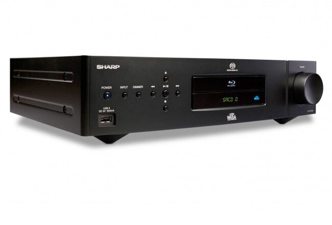 Black Sharp Blu-ray disc player with a front display, power button, input selection, volume knob, USB port, and various control buttons.