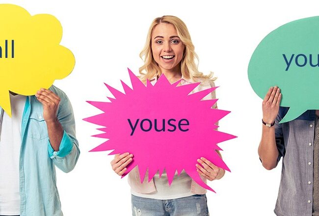 Three people holding speech bubbles with regional variations of "you all": "y''all," "youse," and "you guys."