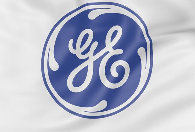 Blue and white GE logo on a fabric surface, representing General Electric.