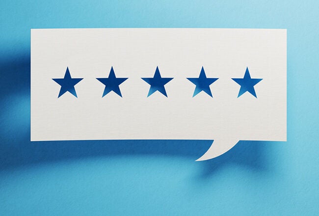 A speech bubble with five blue stars inside, representing a five-star rating or positive feedback.