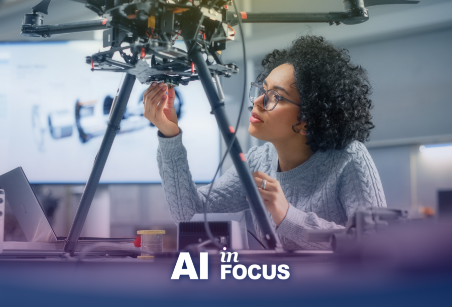 Woman engineer adjusting a robot prototype to show how AI and robotics are redefining productivity with a text overlay that reads "AI in Focus"