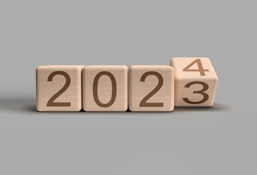 Graphic of wooden blocks with 2023 written on them and the last box turning over to become 2024