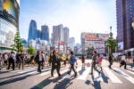 People crossing the street in the Shinjuku shopping district in Tokyo, Japan