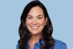 Headshot of Jennifer Tejada smiling in a front of a blue background