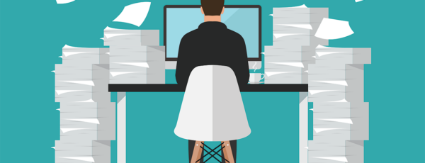 Illustration of a worker typing on a laptop and surrounded by piles of paperwork because of the AI efficiency trap
