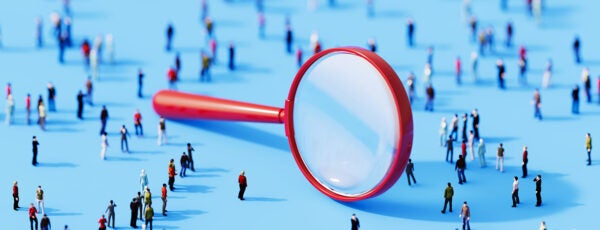 3D illustration of a giant magnifying glass surrounded by a crowd of people to show how firm-driven search impacts startup growth