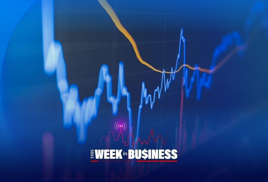 A financial graph with blue and orange lines on a chart, overlaid with the text "This Week in Business" featuring a stylized skyline and a broadcasting symbol.