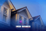 Gabled roof of a house with decorative windows during sunset. 