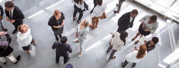 Birds eye view of employees socializing in a room