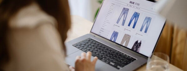 Young woman shopping online on her laptop