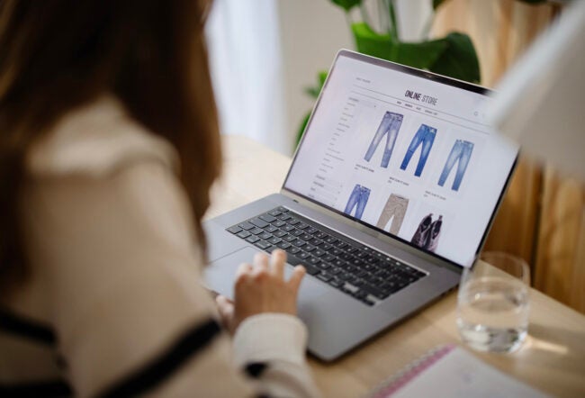 Young woman shopping online on her laptop
