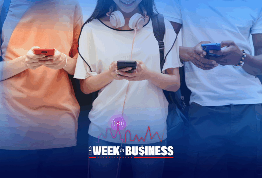 Three people holding smartphones, each focused on their device. Overlaid text reads "This Week in Business" with a signal icon and graph.