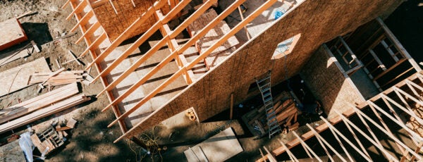 Overhead view of constructor workers building a house