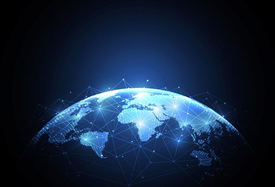 A digital representation of Earth viewed from space, with illuminated network connections spanning across continents, symbolizing global connectivity.