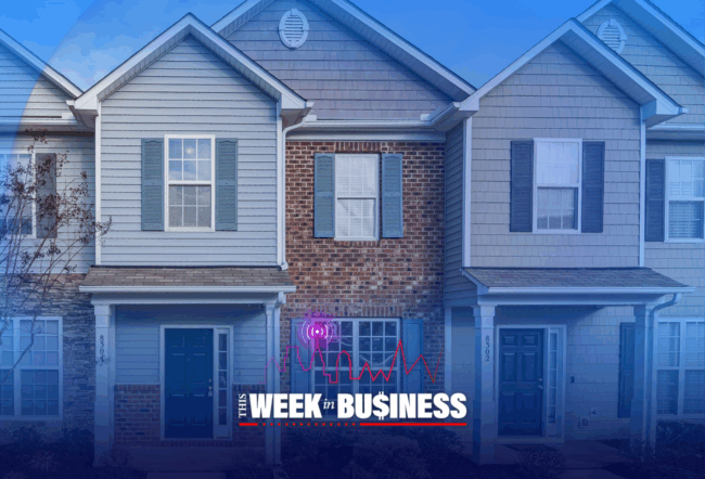 Row of modern suburban townhouses with blue and beige siding, featuring front doors and windows. The text "This Week in Business" is overlaid at the bottom.