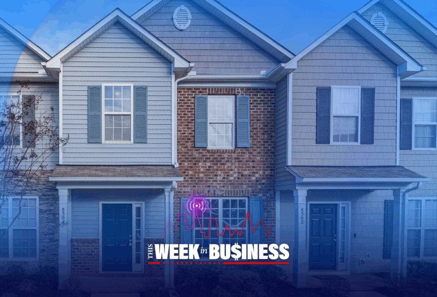 Row of modern suburban townhouses with blue and beige siding, featuring front doors and windows. The text "This Week in Business" is overlaid at the bottom.