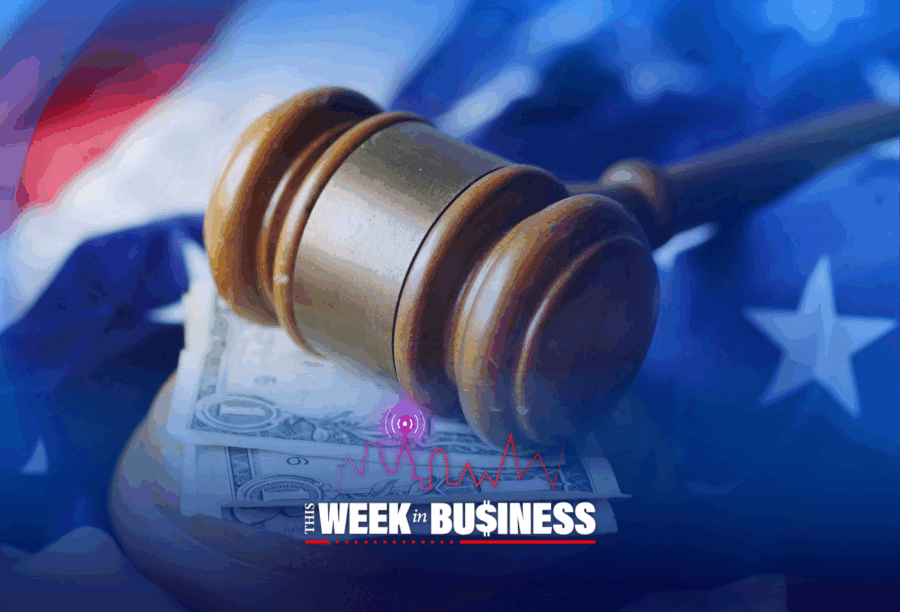A judge's gavel on top of money, with the American flag in the background, and the text "This Week in Business" at the bottom.