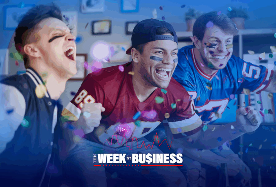 A few enthusiastic people in sports jerseys cheering indoors with confetti falling around them. Text at the bottom reads "This Week in Business."